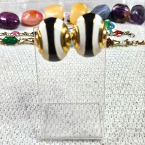 Enamel gold tone clip earrings